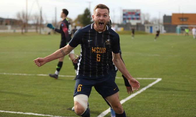 MSUB's Brad Lowes celebrates one of the three Yellowjacket goals against Simon Frase on Senior Day in Billings.