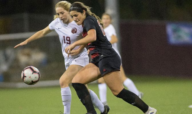 Alyssa Tomasini (black jersey) earned First Team All-GNAC honors as a junior in 2019 after she led the conference with nine goals, four game-winners and 25 points.