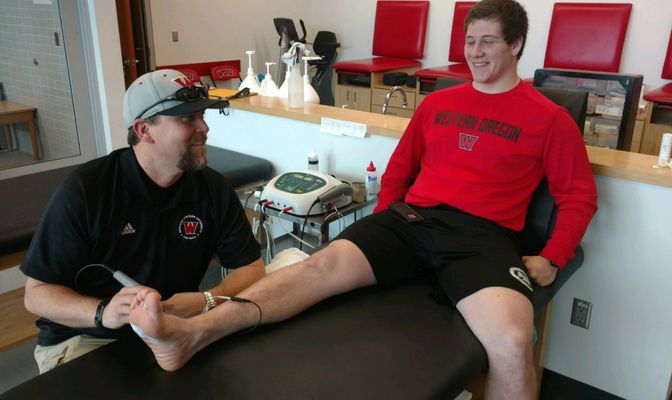 Chris Thew spent most of his first year at Western Oregon focusing on athletic training duties with the Wolves' football program.