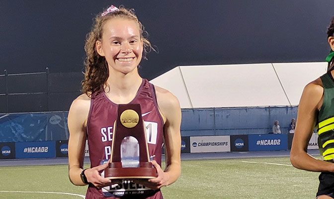 Annika Esvelt placed fourth in the 10,000 meters in a time of 33:51.65, making her just the fourth woman in GNAC history to run under 34 minutes in the event. Photo by Chris Reed.