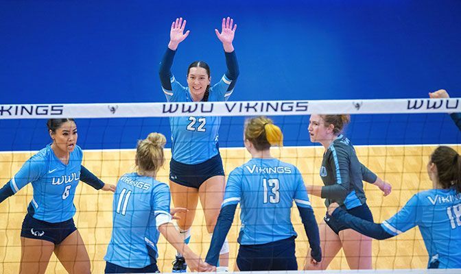 Gabby Gunterman (raising hands, center) and Western Washington beat Seattle Pacific and Montana State Billings to improve to 6-0 at home this season.