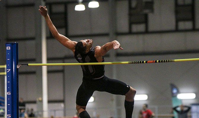 Saint Martin's Mikel Smith broke his own GNAC record in the men's high jump with a mark of 7 feet, 3 inches, repeating as conference champion. Photo by Loren Orr.