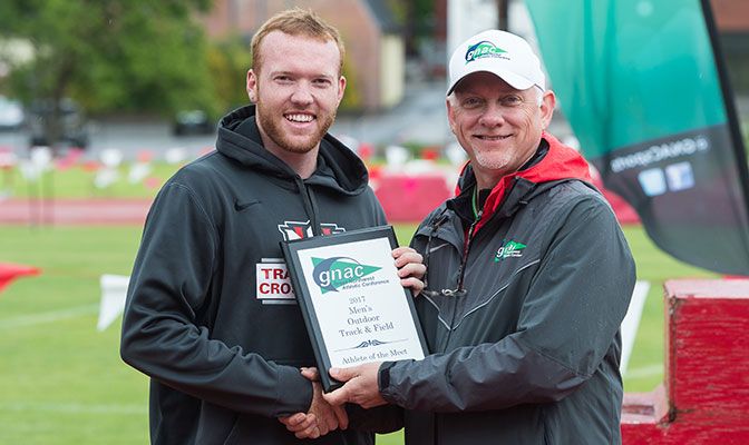 Northwest Nazarene's Payton Lewis (shown with GNAC commissioner Dave Haglund) was named the Male Outstanding Athlete of the Meet. Photo by Chris Oertell.