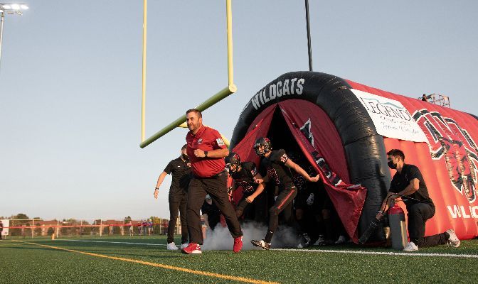 Central Washington Head Coach Chris Fisk leads his team out of the tunnel prior to their home opener against Angelo State.
