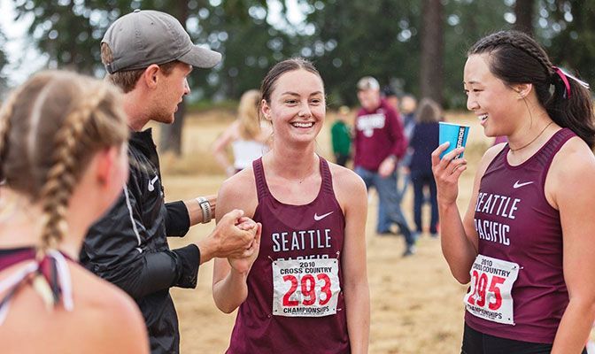 Seattle Pacific's Libby Michael (center) won her first collegiate race, taking the Puget Sound Invitational in 18:58.