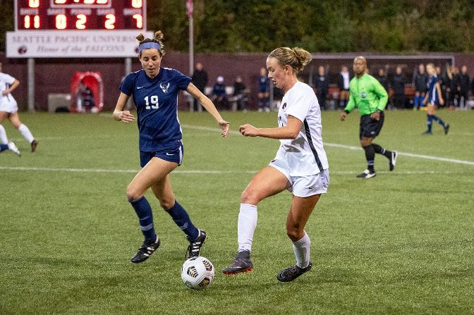 Makena Rietz (right) earned GNAC Player of the Year honors after scoring a conference-high 10 goals. Also pictured is the GNAC Newcomer of the Year, WWU's Tera Ziemer (No. 19).