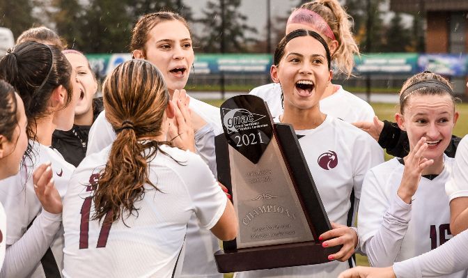 Seattle Pacific women's soccer players Makena Rietz (No. 17), Sophia Chilczuk (third from right) and Madison Ibale (second from right, holding trophy) were all named 2021 All-Americans.