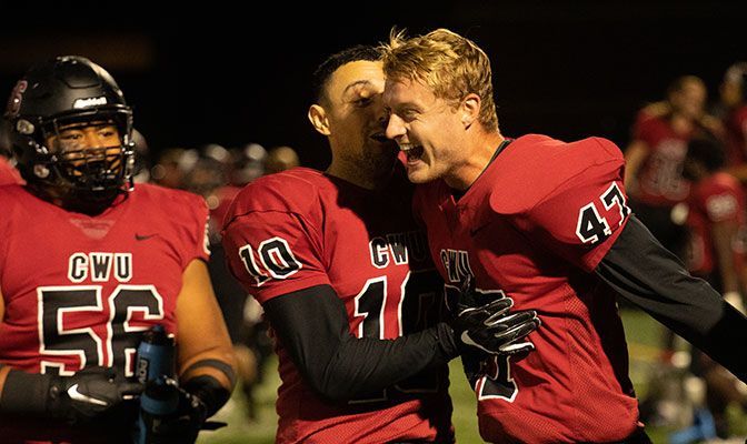Central Washington kick Patrick Hegarty (right) tied a GNAC single-game record with 10 extra points made in Saturday's 92-0 win over Lincoln (Calif.).