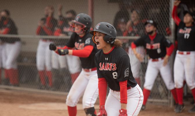 Destiny Conerly (center) walked and scored a run during Saint Martin's eight-run seventh inning that iced a 10-0 victory over CWU. Photo by Jacob Thompson.