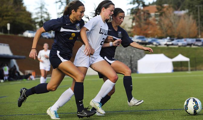 Western Washington forward Elise Aylward and two MSUB players go after ball during game earlier this season.