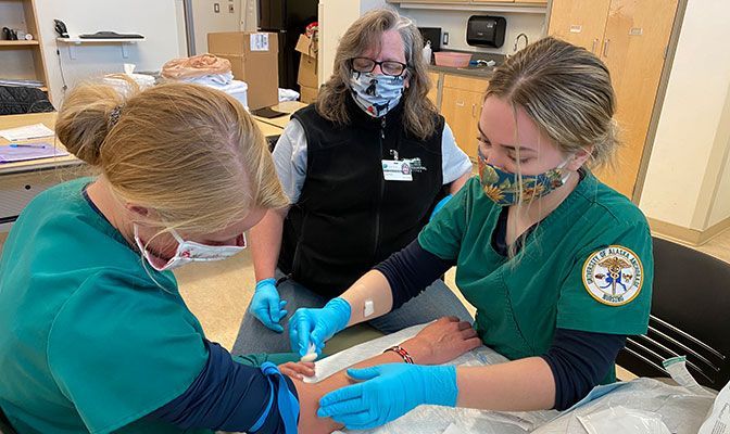 During the height of the COVID-19 pandemic, Ruth Cvancara (left) and other Alaska Anchorage nusring students took part in clinical rotations at Providence Alaska Medical Center.