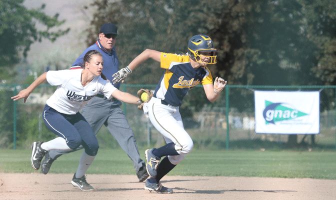 MSUB's Heather Tracy is tagged out by shortstop Alicia Fine during Thursday's first-round game (Photo by Joe Epperson)