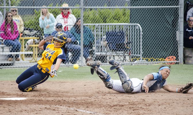 Bella Rovens scores on a sixth-inning sacrifice fly by Taylor Hoke in Saturday's 12-inning loss to Sonoma State (Photo by Aaron Meza)