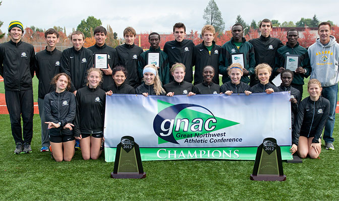 After sweeping the GNAC team titles, the Alaska Anchorage Seawolves posed in front of their 2012 hardware. Both teams set GNAC records for lowest team scores. (Photo by Ritch Fuhrer)