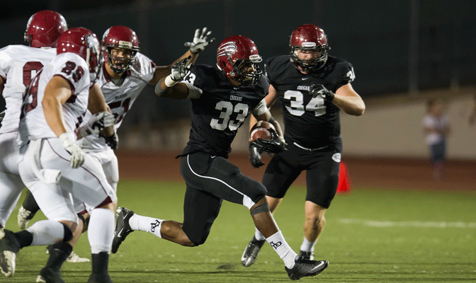 Terrell Watson (33) rewrote the GNAC rushing record book last year running for 1,812 yards and 23 touchdowns.
