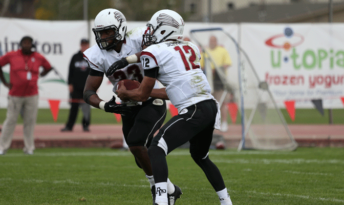 APU's Terrrell Watson takes a handoff from quarterback Chad Jeffries earlier this season.  Watson was one of three GNAC players named to the AFCA All-American team Tuesday.