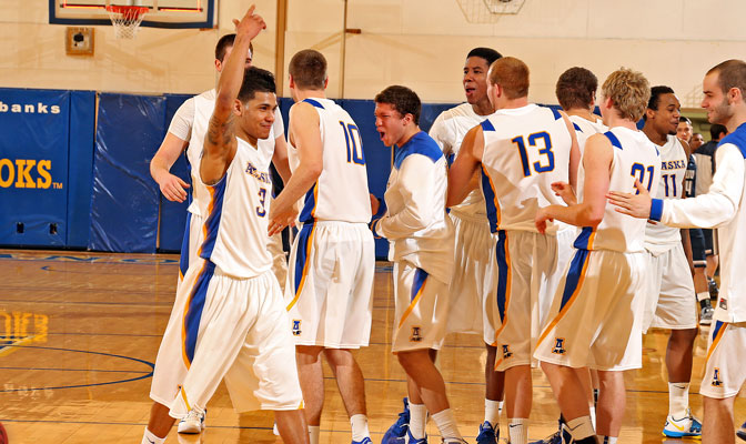 Dominique Brinson (3) and his teammates celebrate Thursday's win against Western Washington (Photo by Paul McCarthy).