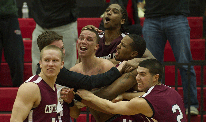 Teammates (from left), including Jordan Coby, Joey Roppo, Nate Walker, Brandon Magee and Jordan Starr mob Mark McLaughlin after he hit (below) game-winning three-pointer (Photos by Dan Levine)
