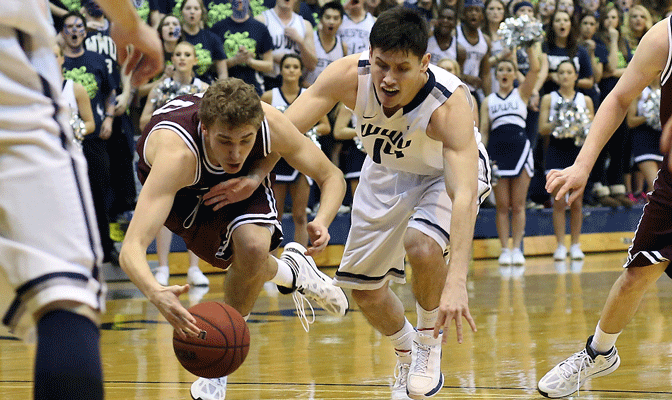 SPU's Matt Borton and WWU's Richard Woodworth chase down ball in game earlier this season.  SPU is ranked fourth and WWU is ranked seventh in first NCAA West Regional poll.