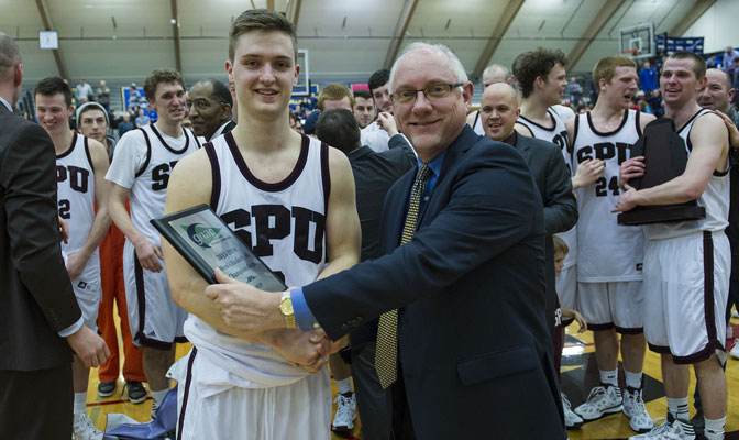David Downs receives Tournament MVP award from Commissioner Dave Haglund last Saturday.  Downs earned another award Thursday as he was voted Player of the Year in West Region.