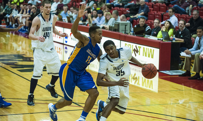 Jeffrey Parker (35) scored 21 points to lead WWU past UAF.  Ronnie Baker (11) led the Nanooks with 18 points.  Viking center Austin Bragg (44) had eight points and six rebounds (Photo by Dan Levine).