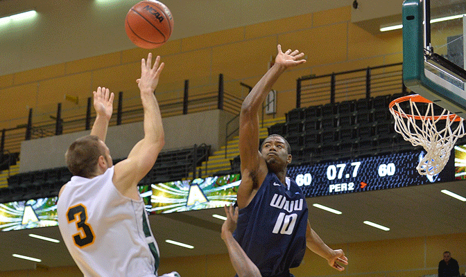 Brian McGill releases game-winning shot over WWU defender Anye Turner with 7.7 seconds left in Alaska Anchorage victory Saturday (Photo by Sam Wassom).