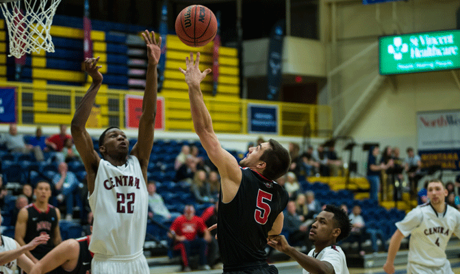 Mike Wright (5) scored 20 points and also had four assists and three steals in NNU's 79-73 win.  CWU's Joseph Stroud (22) had 12 points and nine rebounds (Photo by Aaron Selig)