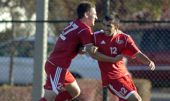 Ryan Dhillon (12), being congratulated by Alex Rowley (27), has scored seven goals and also has five assists this fall.