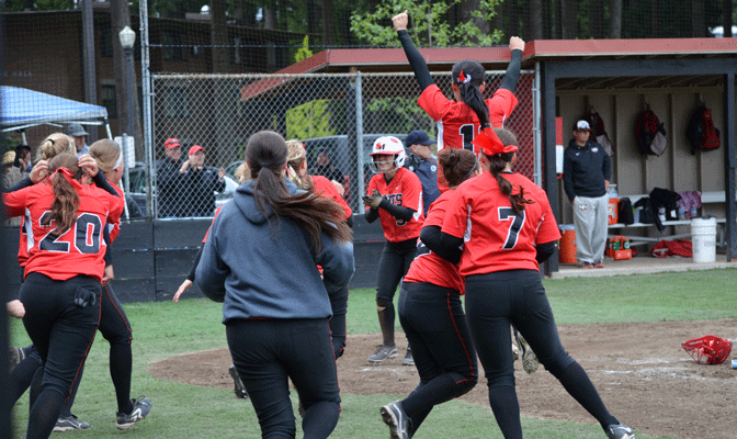 Saint Martin's players celebrate after clinching tie for regular-season title Saturday.