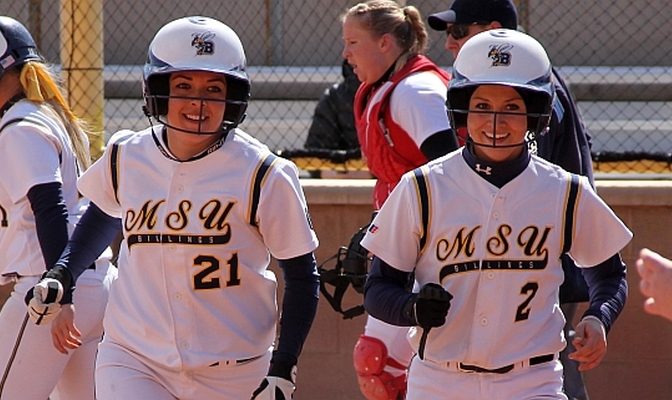 Aubrey Conceicao (21) and teammate Rose Harrington (2) led MSUB to three wins last weekend.  Conceicao had six extra-base hits and a monster 1.727 slugging average.