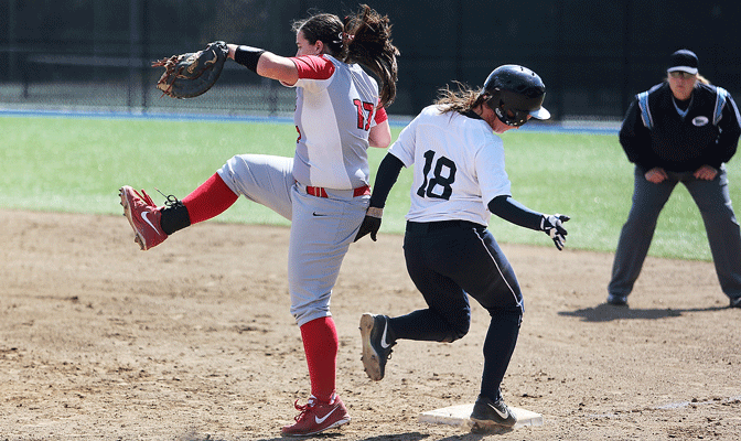 Western Washington's Hayley Baker (18) and Northwest Nazarene's Brianna Kinghorn race to the bag in Friday's game (Photo by Nick Gonzales)