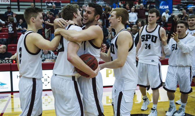 Matt Borton and Ryan Todd hug after Seattle Pacific's victory last March in GNAC championship game.  Todd was one of four SPU players named to NABC Honors Court.