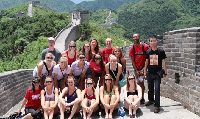 NNU's volleyball team visited the Great Wall of China to begin its summer tour.