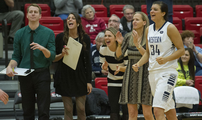 Carmen Dolfo (second from right) and her staff have led Vikings to a 25-3 record this winter.  Kayla Bernsen (34) has been a key player off the bench leading team in blocks  (Photo by Dan Levine)