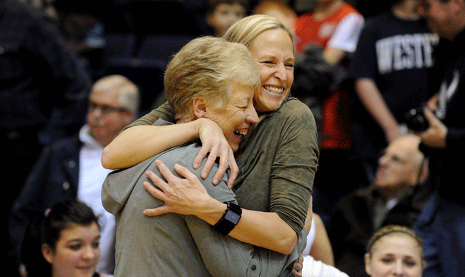 The two winningest coaches in WWU history - current athletic director Lynda Goodrich and Viking head coach Carmen Dolfo - embrace after Vikings' victory Tuesday (Photo by Dan Levine).