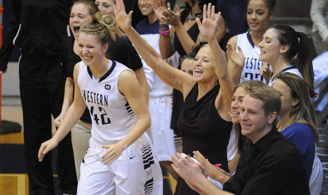 Sydney Donaldson (42) joins Viking coaching staff in cheering on WWU victory (Photo by Dan Levine)
