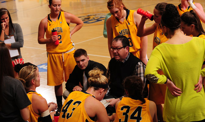 Woodin (center, in glasses) has led MSUB to a 141-95 record in nine seasons.