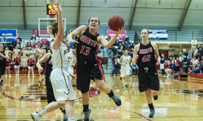 Angela Gelhar (13) scored 21 points and Megan Wiedeman (42) had 17 rebounds to lead Saints to their first GNAC playoff victory (Photo by Dan Levine)