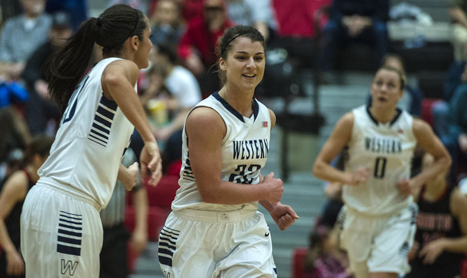 WWU junior Jenni White (center) totaled 15 points, nine assists and five rebounds in the Vikings' 81-71 semifinal win over Saint Martin's.
