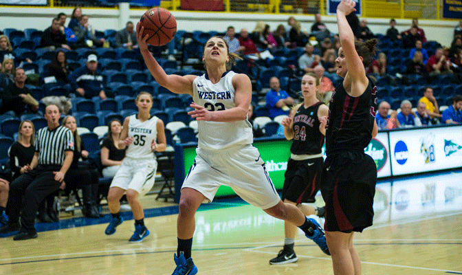 Jenni White goes inside for two of her 16 points in Wednesday's opening round victory (Photo by Aaron Selig).
