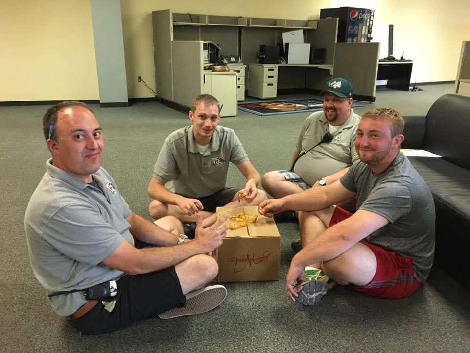 Brian Lyter, David Kerr and friends share nachos in Gary
